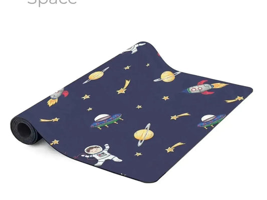 Space-themed yoga or exercise mat with colorful cartoon space motifs on a dark blue background.