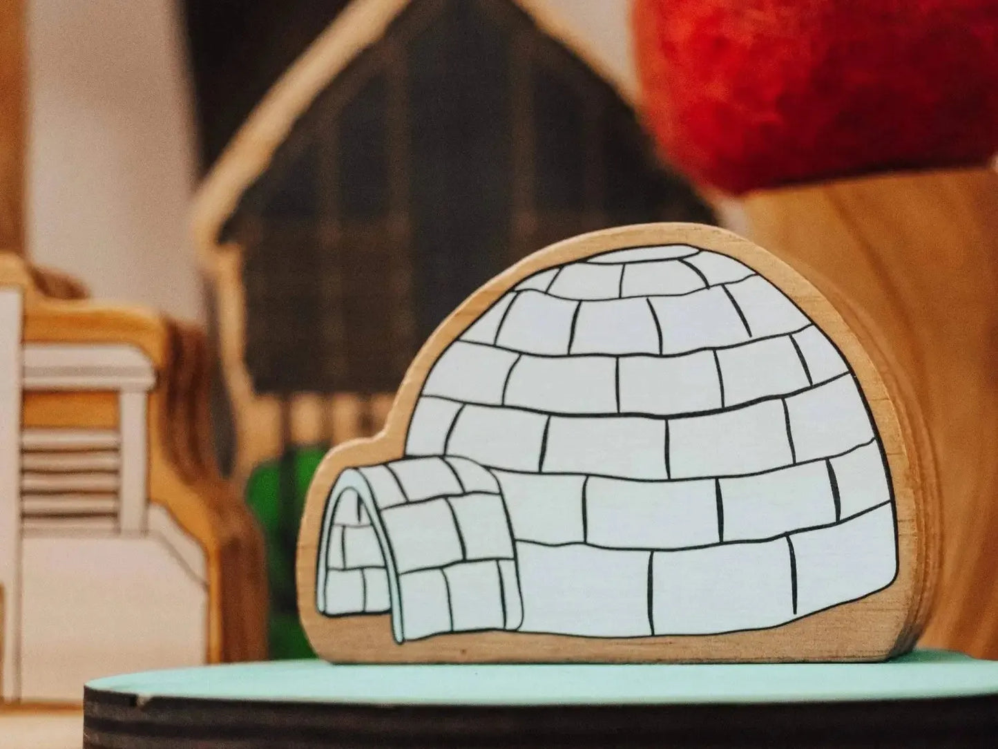 Wooden igloo toy.
