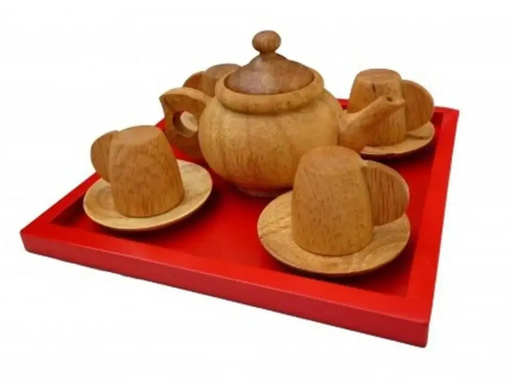 Wooden toy tea set on a red tray.
