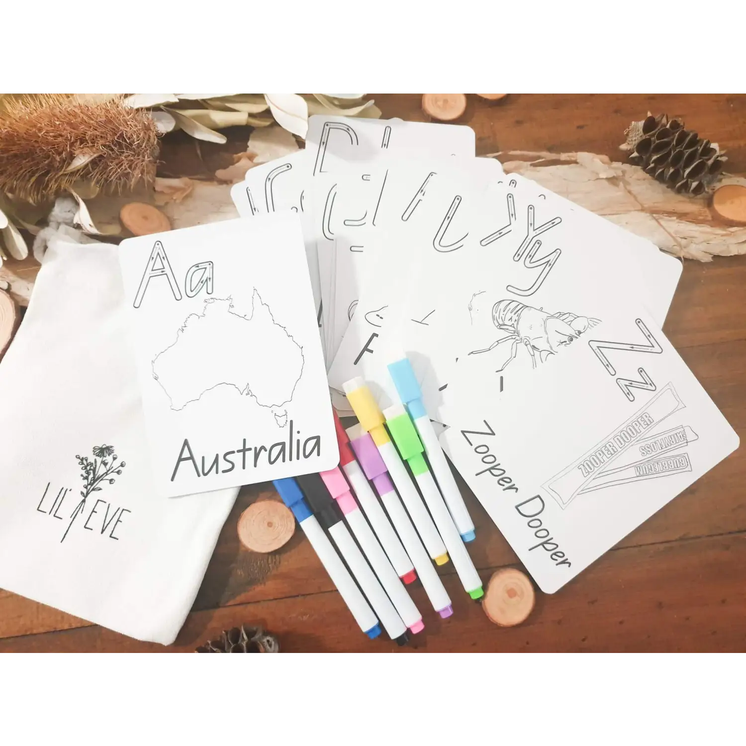 Coloring pages featuring Australian-themed drawings alongside colorful markers.