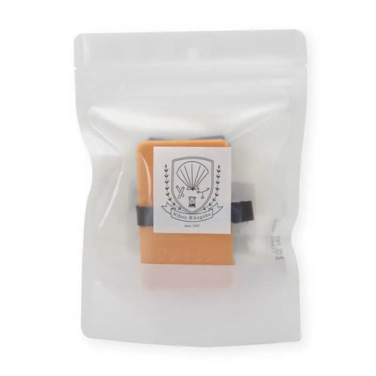 Bar of soap in a clear plastic packaging with a decorative label.