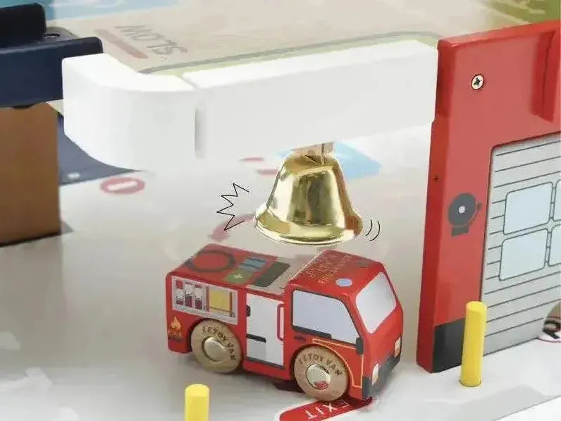Toy fire truck under a bell.