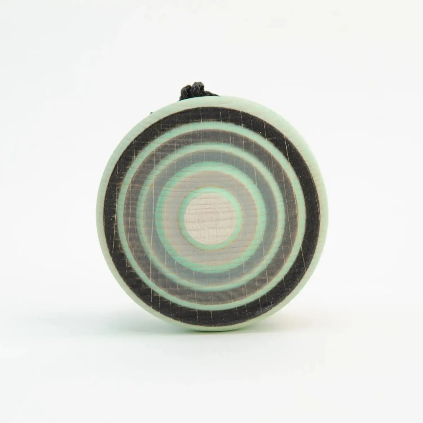 Circular pendant with concentric rings.