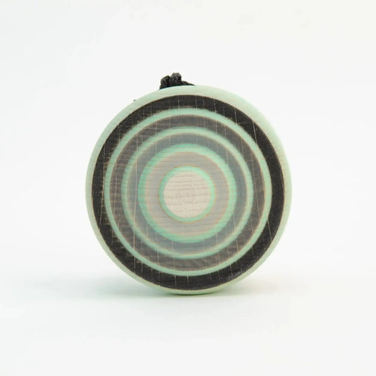Circular pendant with concentric rings.