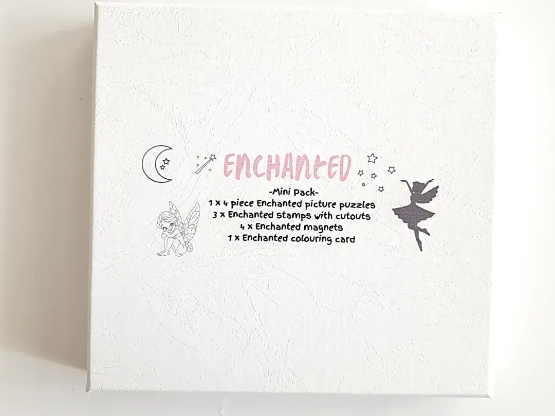 White box or package labeled ’Enchanted’ with decorative illustrations and text describing its contents.