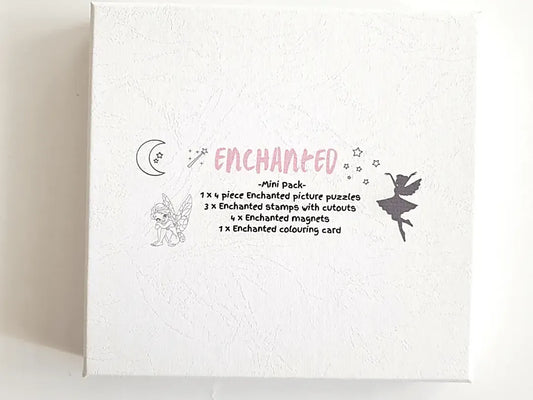 White box or package labeled ’Enchanted’ with decorative illustrations and text describing its contents.