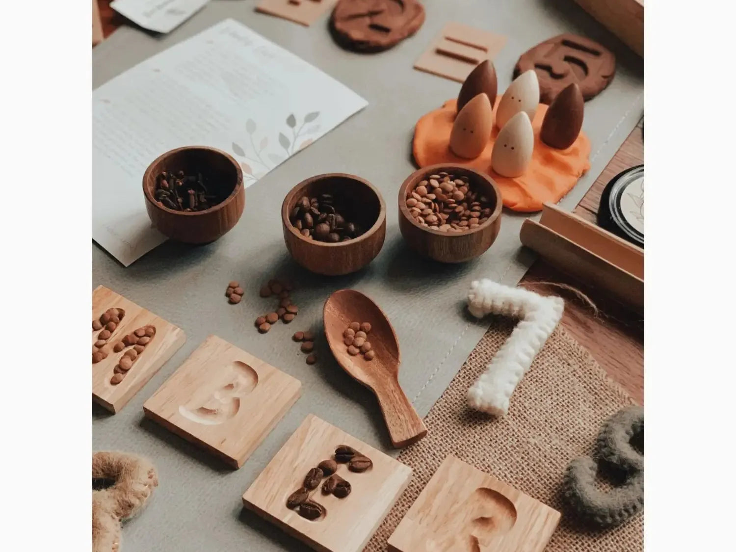 Collection of wooden sensory toys and natural materials for children’s play and learning.