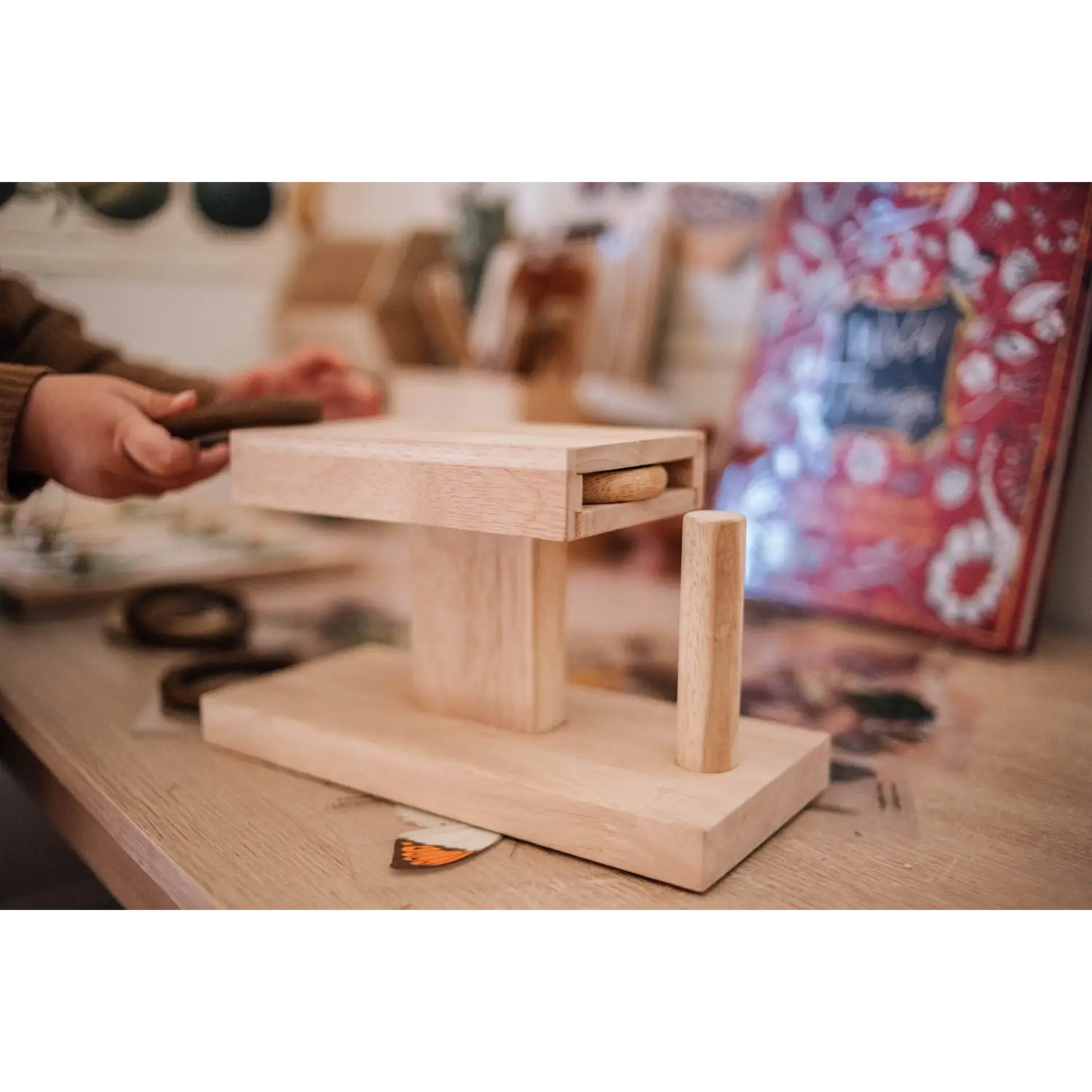 Wooden structure with a raised platform supported by legs.