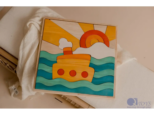 Colorful wooden puzzle depicting a boat on waves under a sun and clouds.