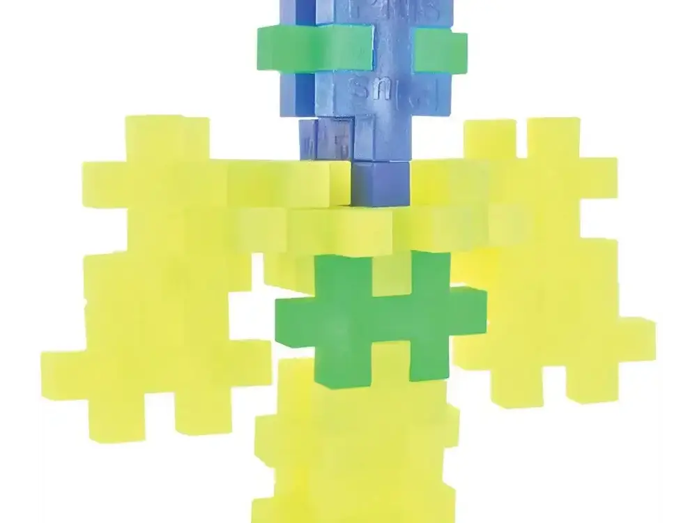 Colorful interlocking plastic building blocks assembled to form a simple figure-like shape.
