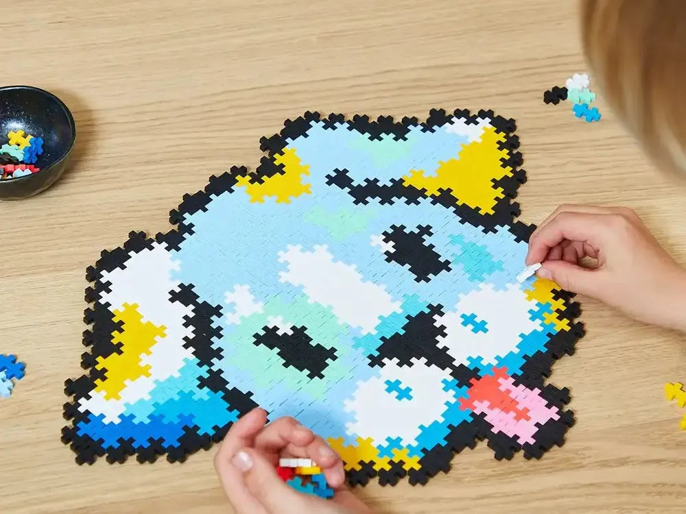 Pixel art puzzle of a blue cartoon fish character being assembled.
