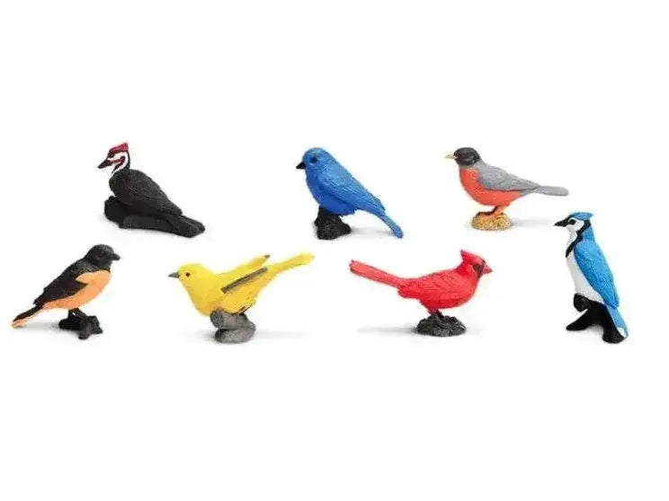 Collection of colorful toy bird figurines representing different species.