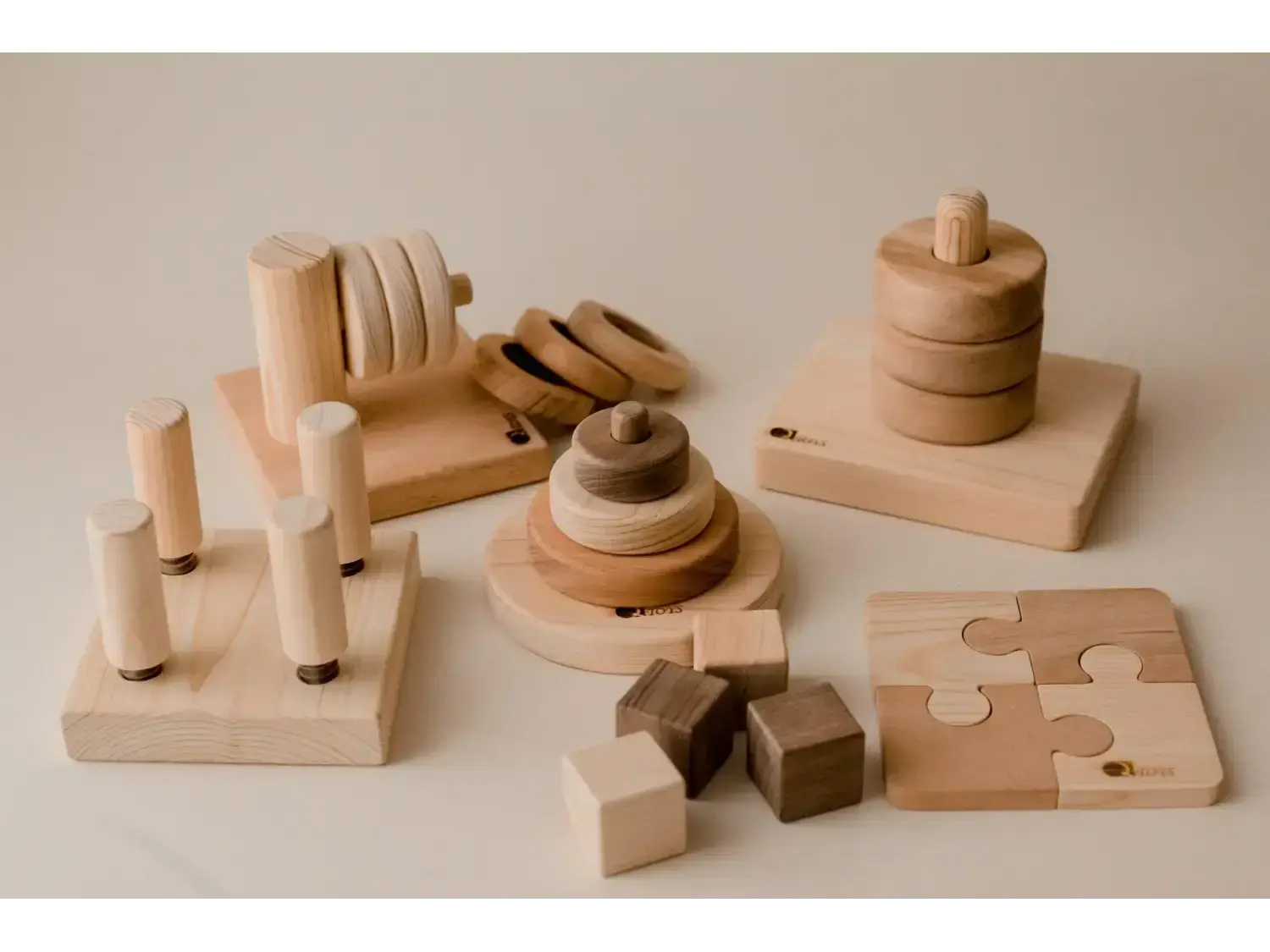 Collection of wooden educational toys and puzzles for children.