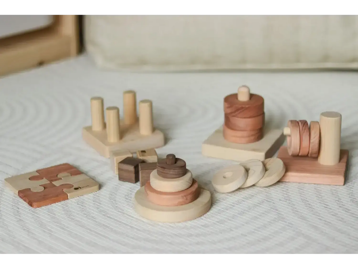 Collection of wooden Montessori-style toys and educational materials.