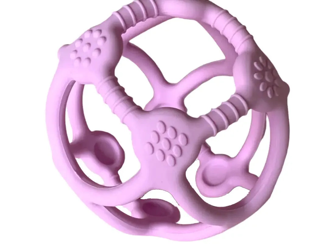 Pink spherical teething toy with various textured surfaces and openings.