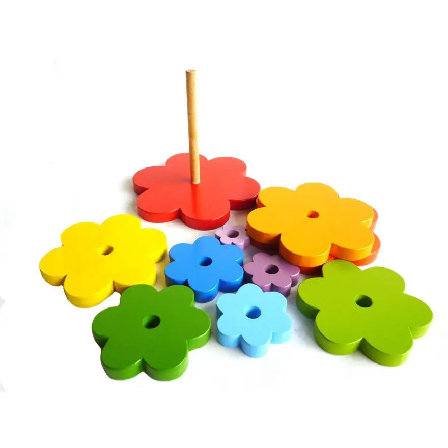 Colorful wooden flower-shaped stacking toy with a central peg.