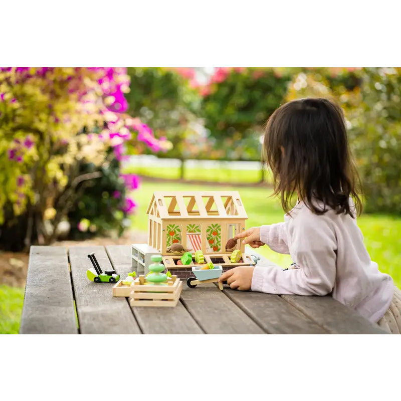 Wooden toy greenhouse.