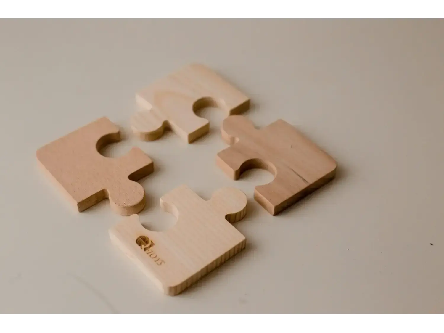 Puzzle pieces in a beige or light tan color.