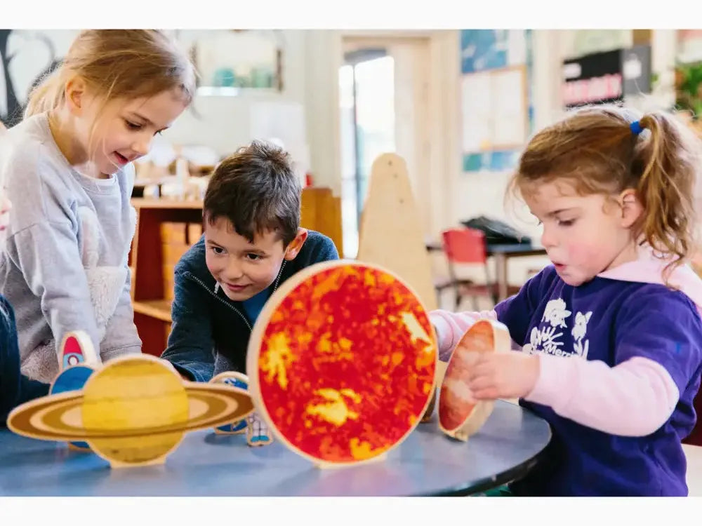 Model of the solar system with colorful planet representations.