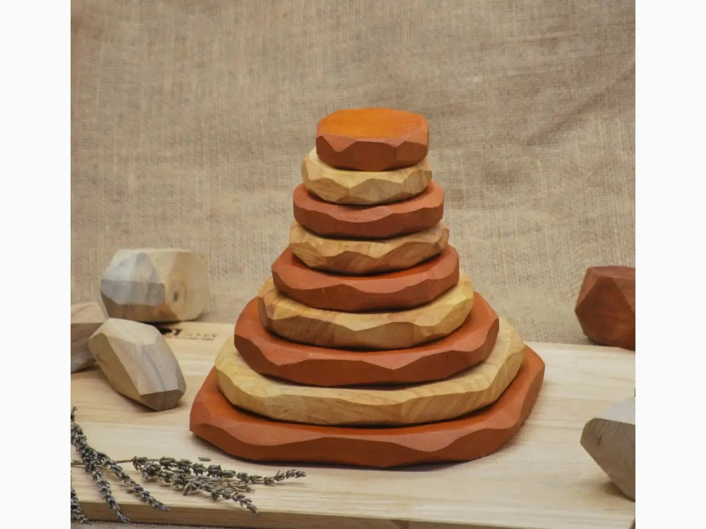 Stacked wooden rings forming a pyramid-like shape.