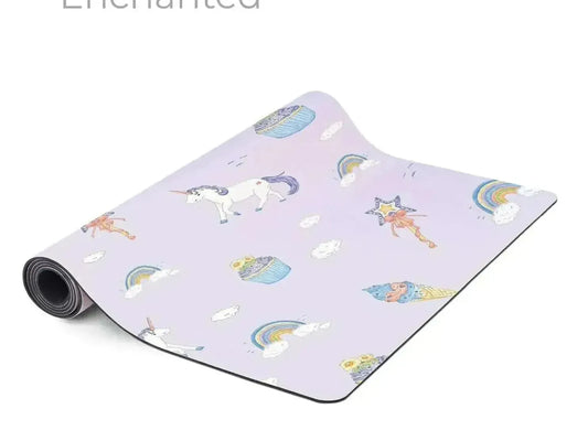 Yoga mat with a whimsical unicorn and rainbow pattern on a light purple background.