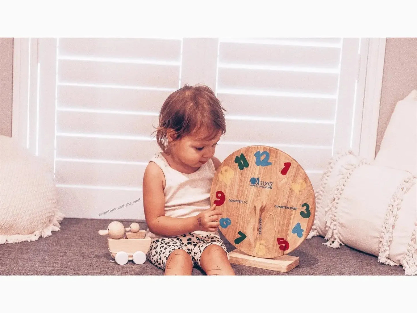 Wooden clock learning toy.