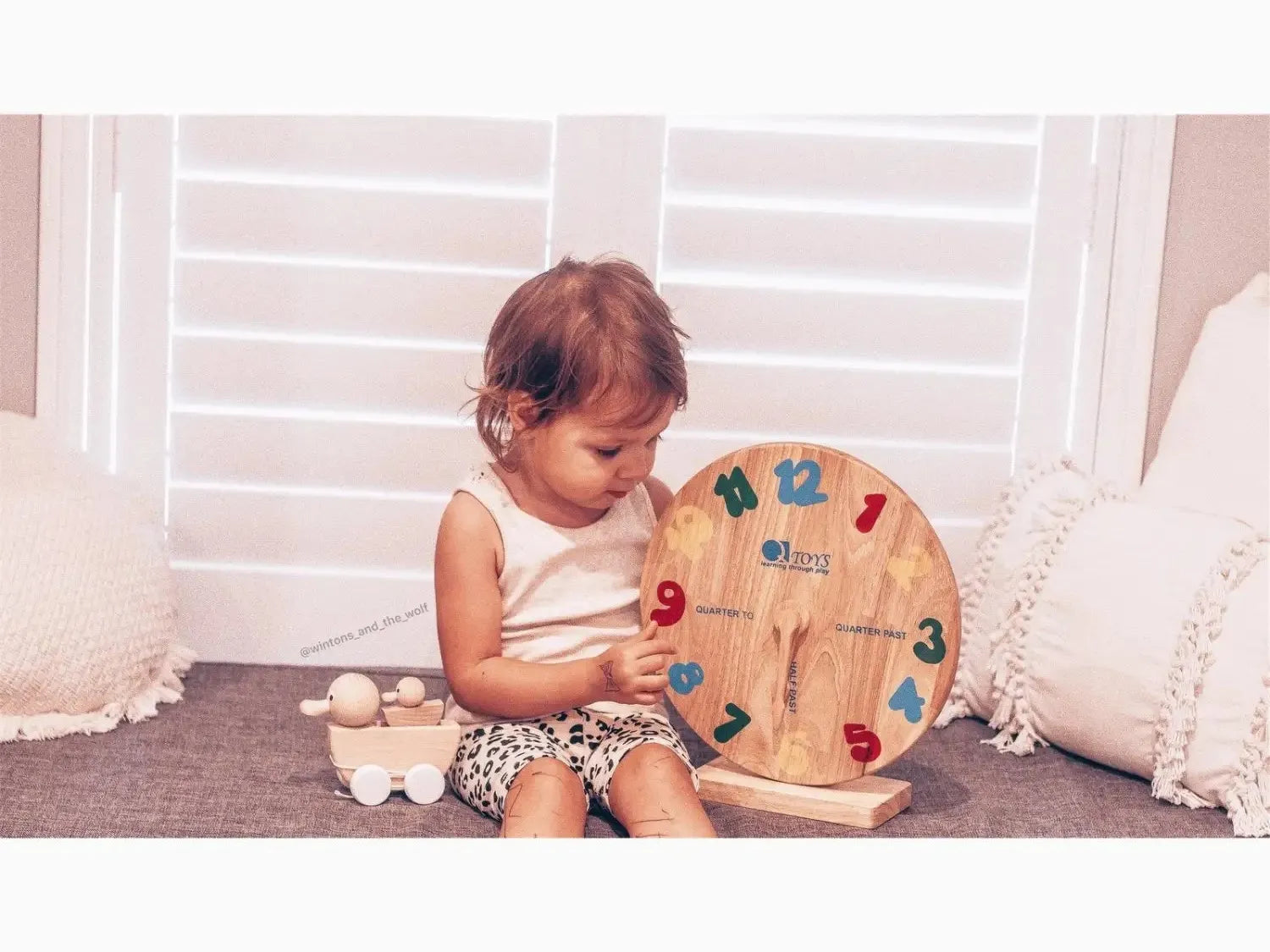 Wooden clock learning toy.