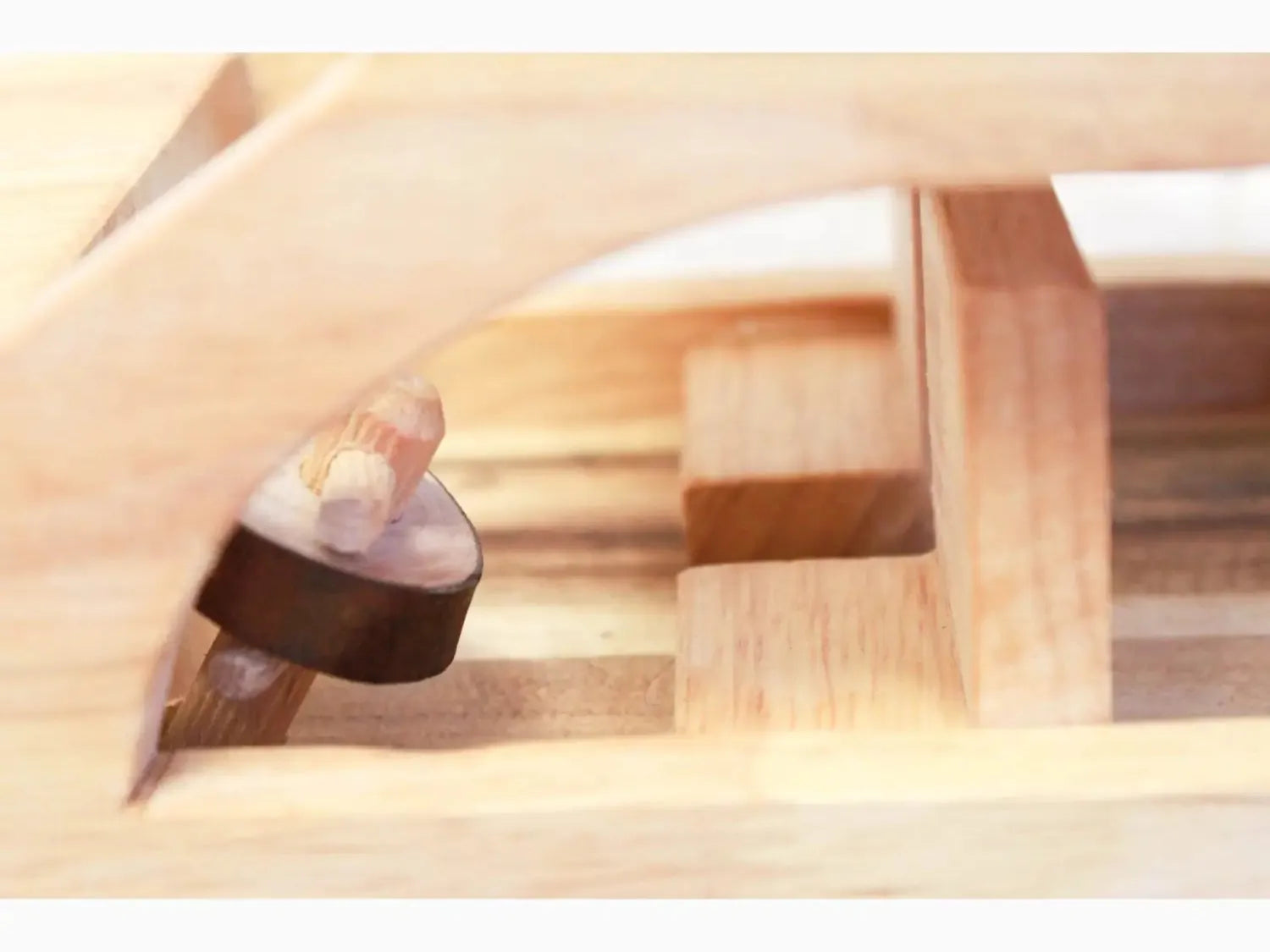 Wooden mallet or hammer with a round head.