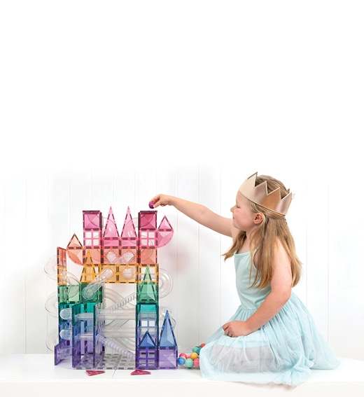 Girl playing with magnetic tiles