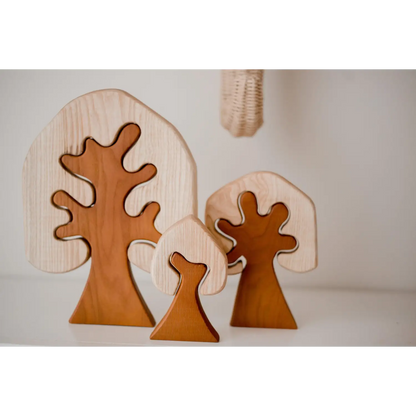 Wooden tree-shaped decorative objects with curved branches.