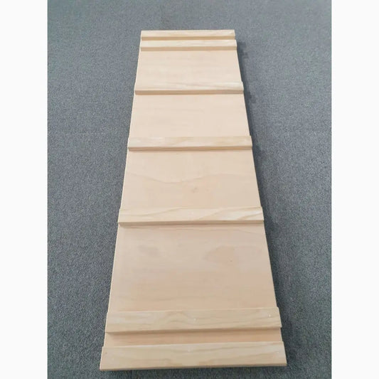 Wooden plank with grooved sections forming a tapered shape.