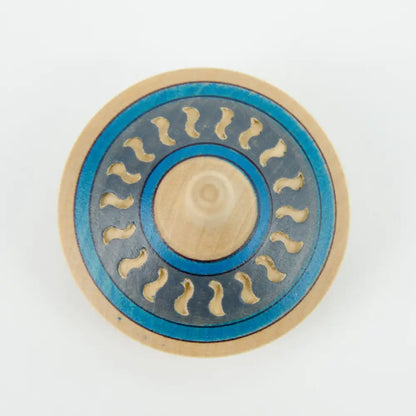 Circular fidget spinner with blue and beige colors featuring wavy patterns.