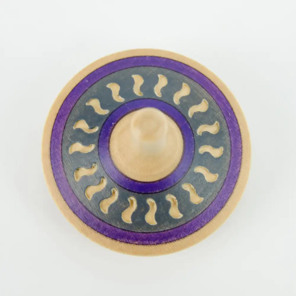 Circular pin or badge with purple, gold, and gray concentric rings featuring wavy patterns.