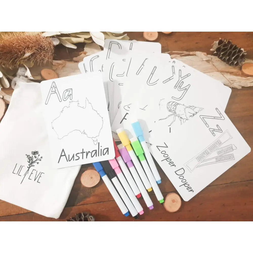 Coloring pages featuring Australian-themed drawings alongside colorful markers.