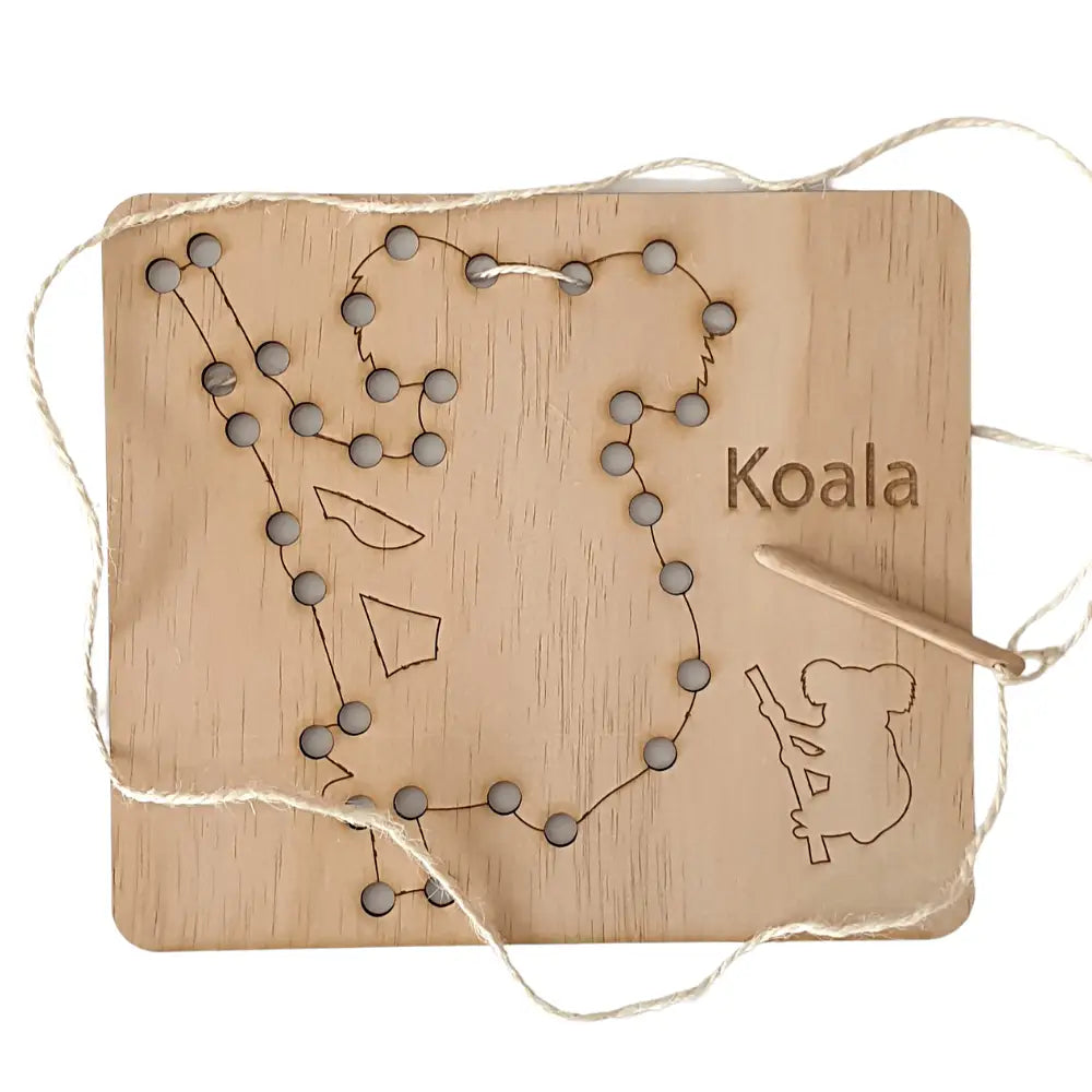 Wooden board with holes and string forming the outline of Australia, featuring ’Koala’ text and a koala silhouette.