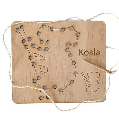 Wooden board with holes and string forming the outline of Australia, featuring ’Koala’ text and a koala silhouette.
