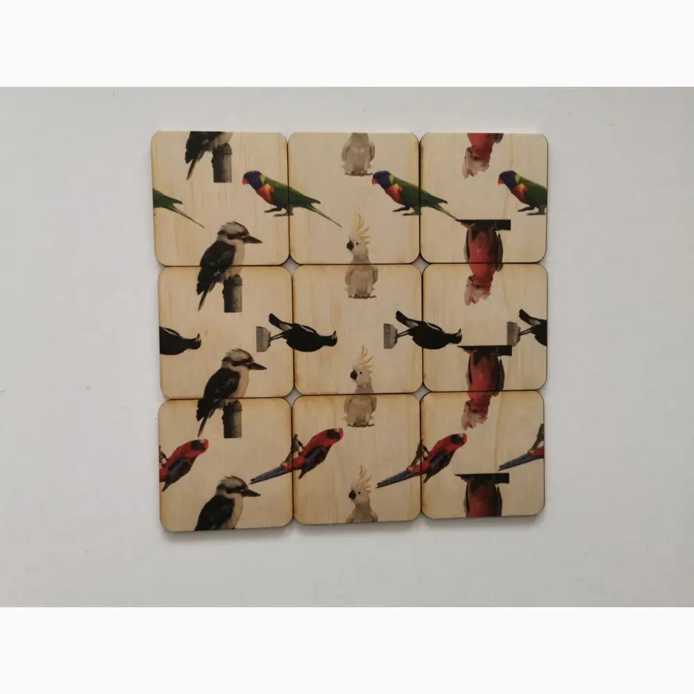 Set of square tiles featuring colorful bird illustrations arranged in a grid pattern.