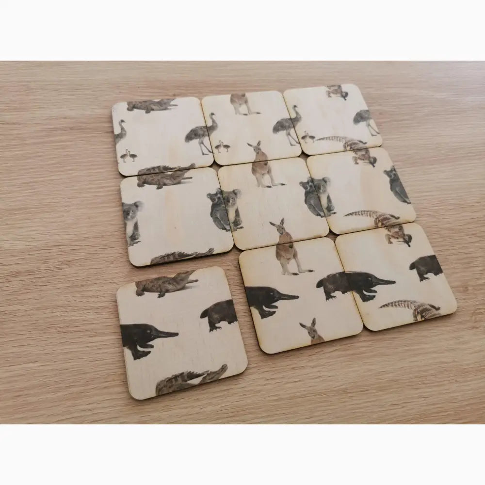 Set of square coasters with Australian animal designs printed on them.