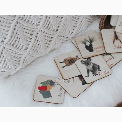 Set of wooden animal flashcards or memory game pieces.