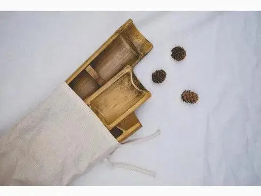 Bamboo serving trays in a cloth bag.