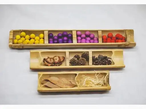 Three-tiered bamboo sensory trays.