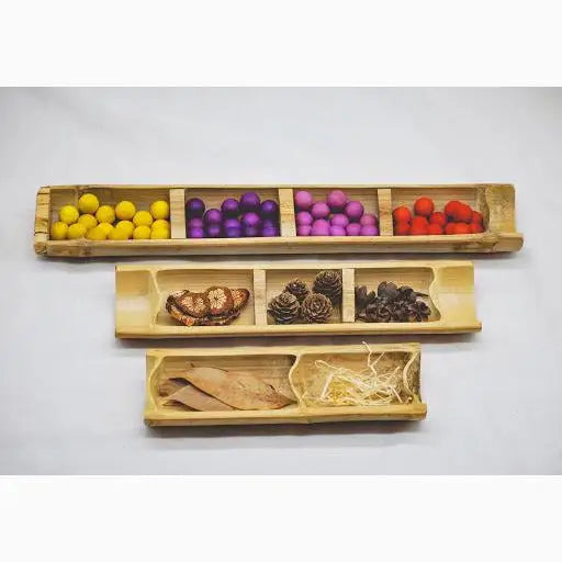 Three-tiered bamboo sensory trays.