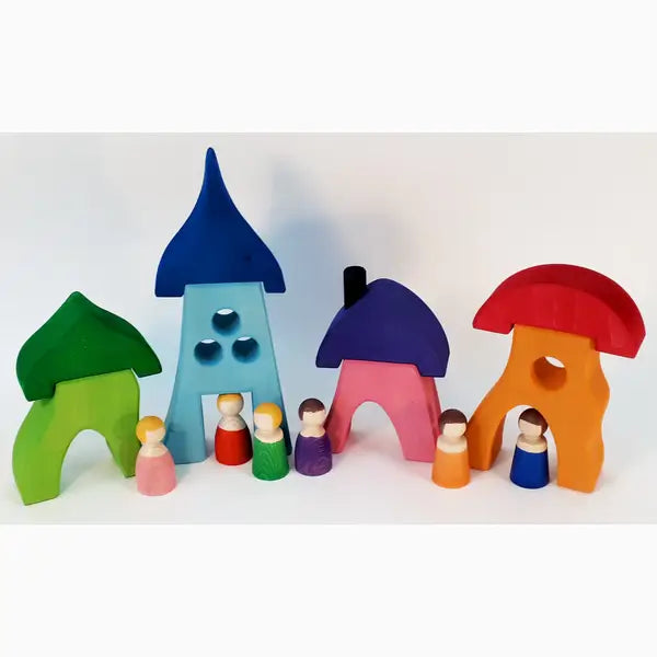 Colorful wooden toy houses and figurines arranged in a row.