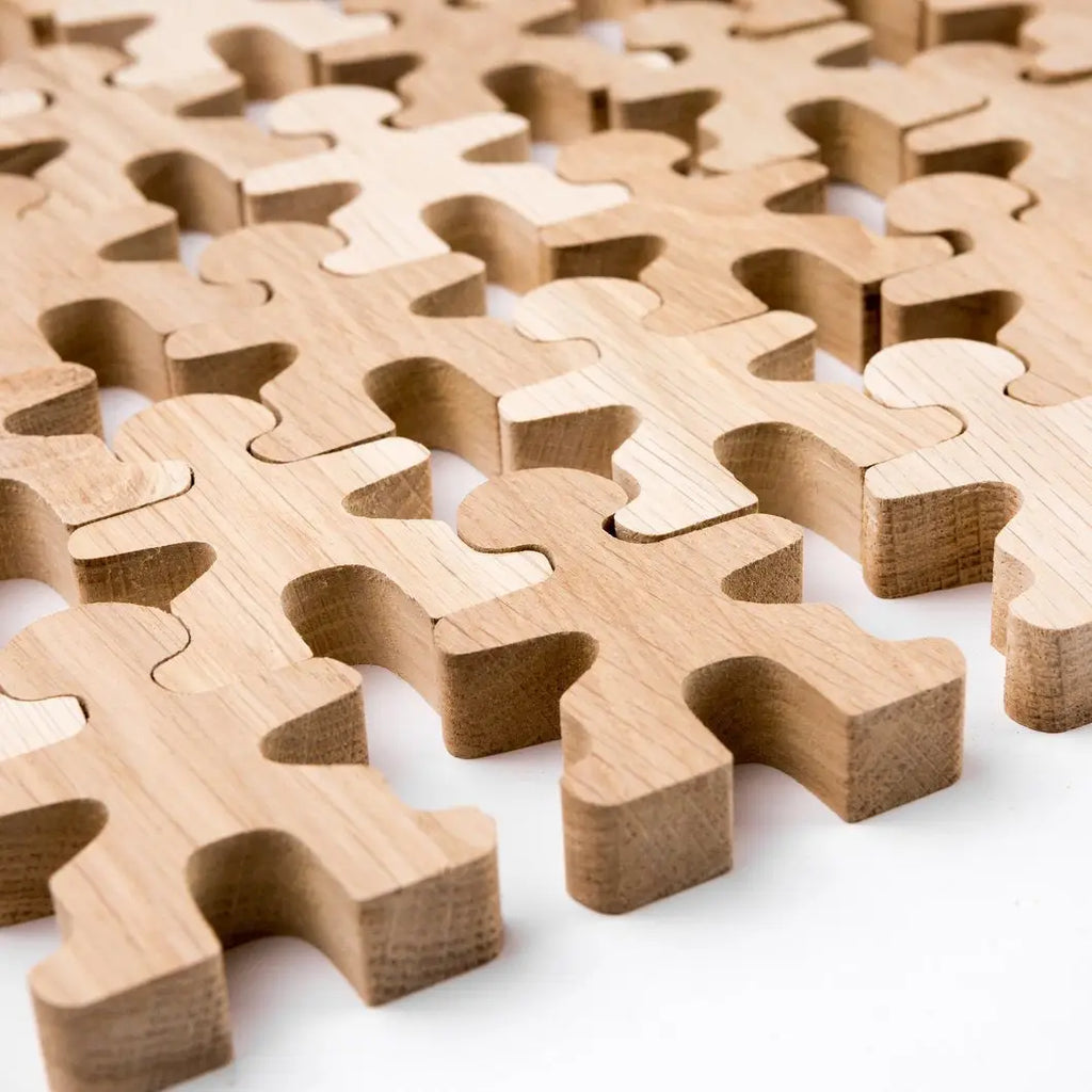 Wooden jigsaw people.