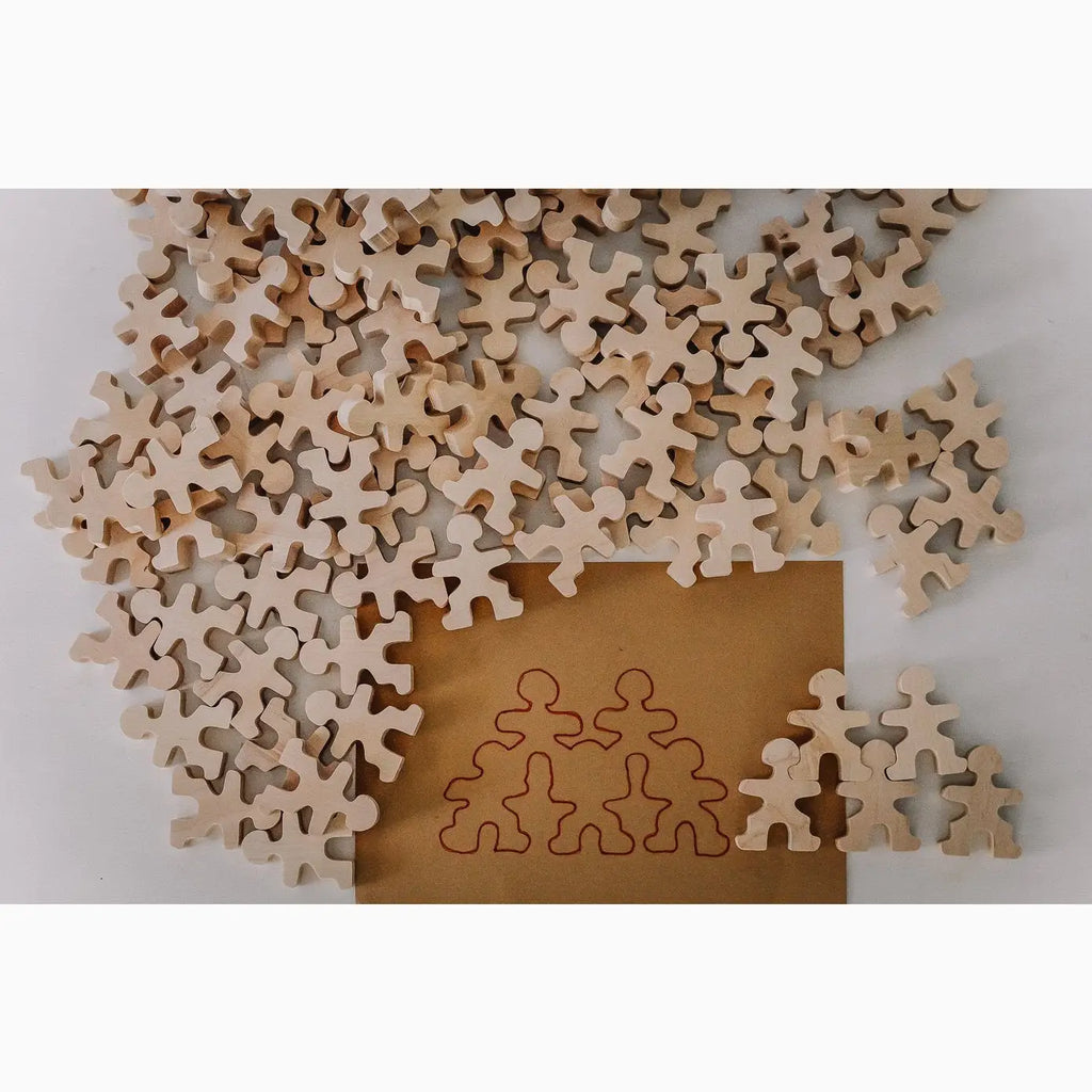 Wooden human-shaped jigsaw puzzle pieces.