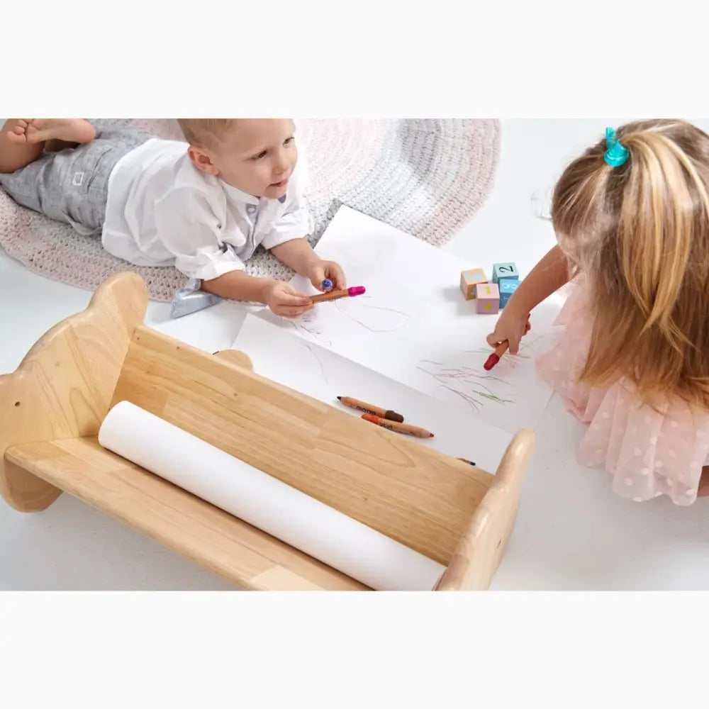 Wooden paper roll holder or dispenser for children’s drawing activities.