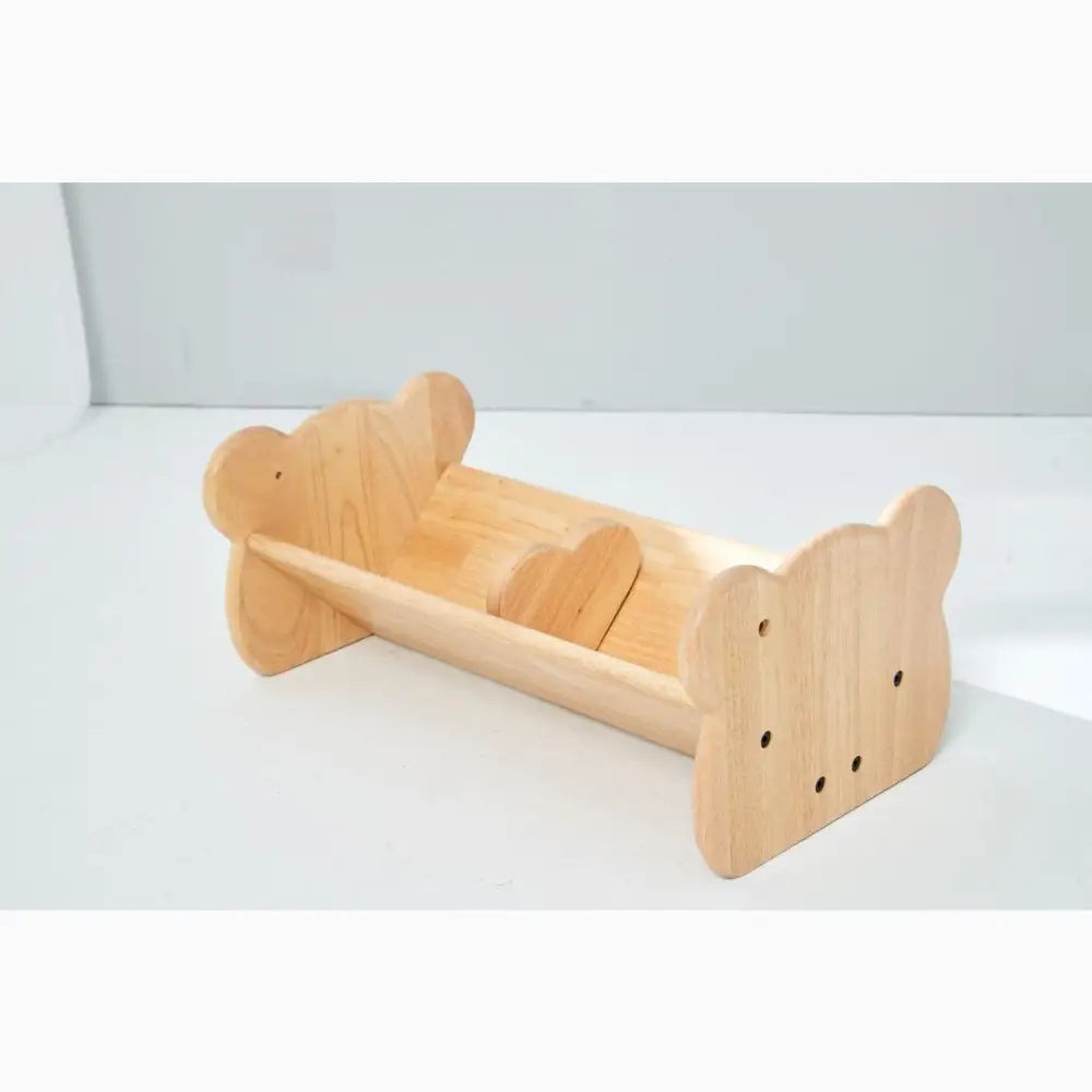 Wooden bear-shaped book holder or shelf.