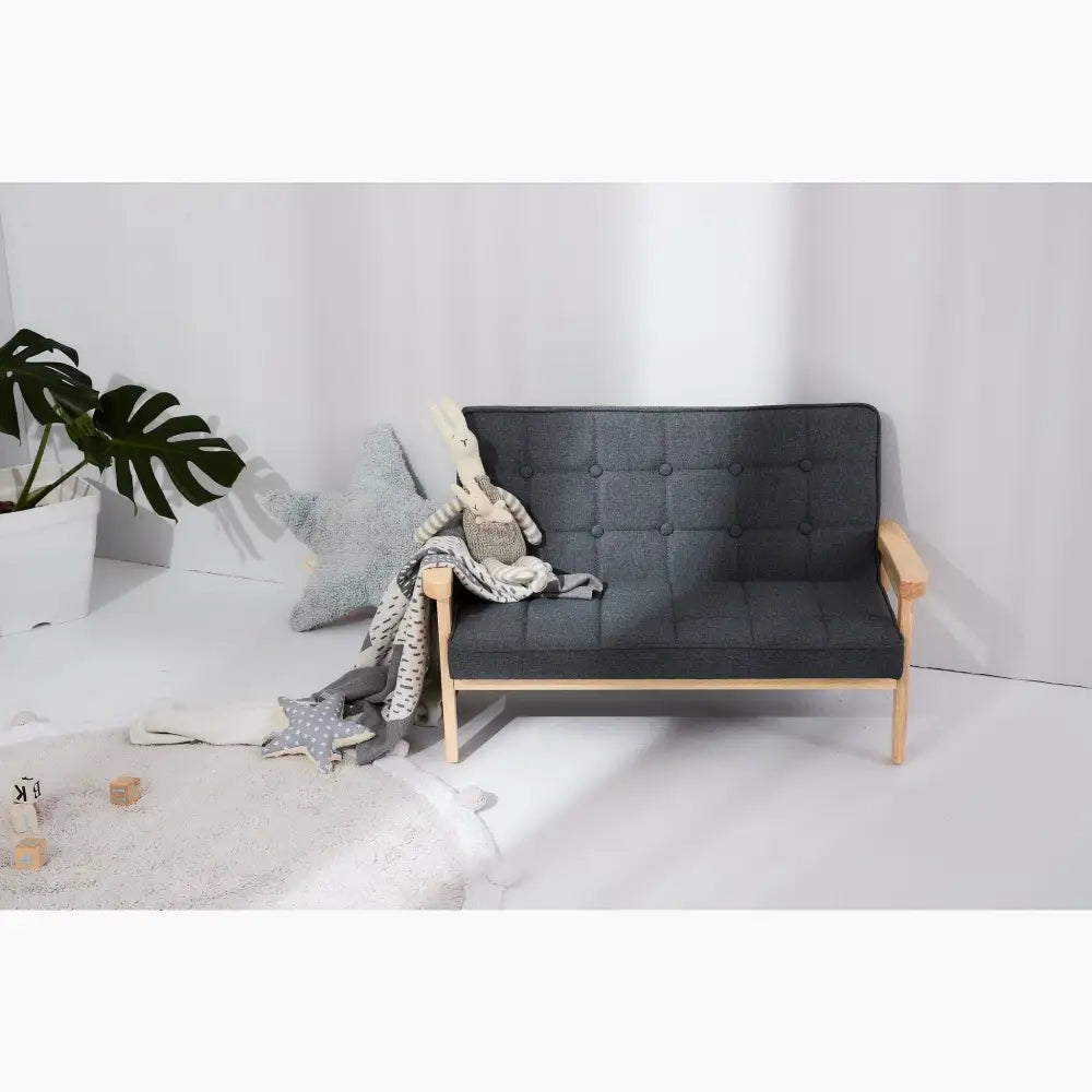 Mid-century modern style sofa with a dark upholstered seat and wooden frame.