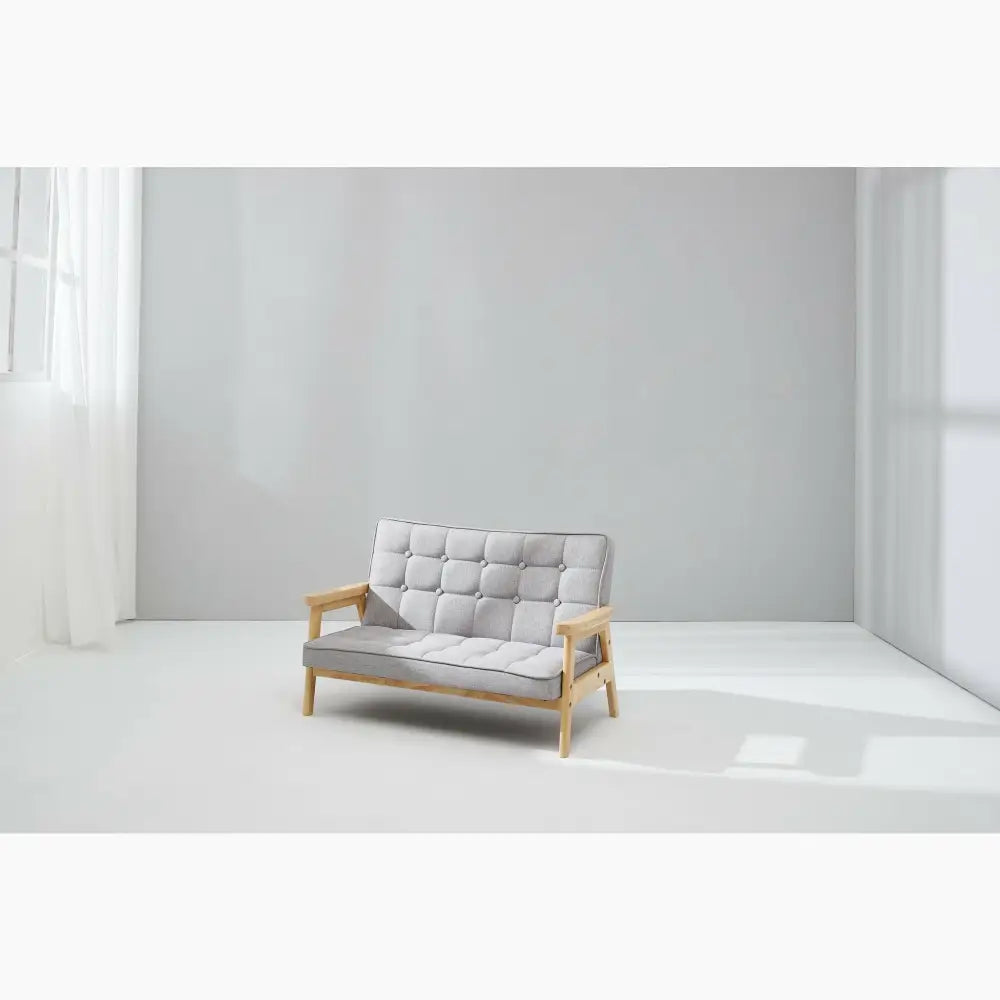 Gray upholstered loveseat with wooden arms and legs.