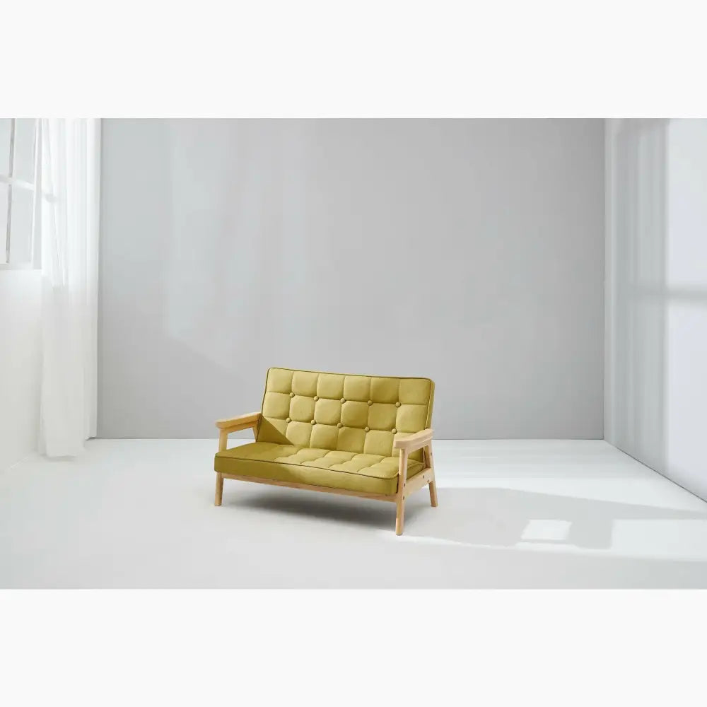 Yellow tufted mid-century modern loveseat with wooden frame.